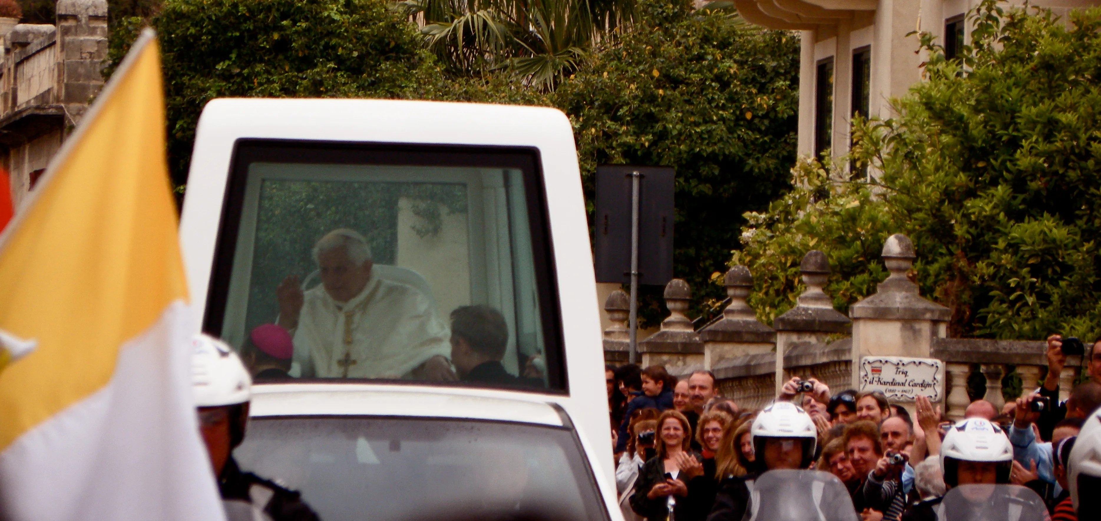 Pope Benedict XVI greeting a crowd from the popemobile during a 2010 visit to Malta.