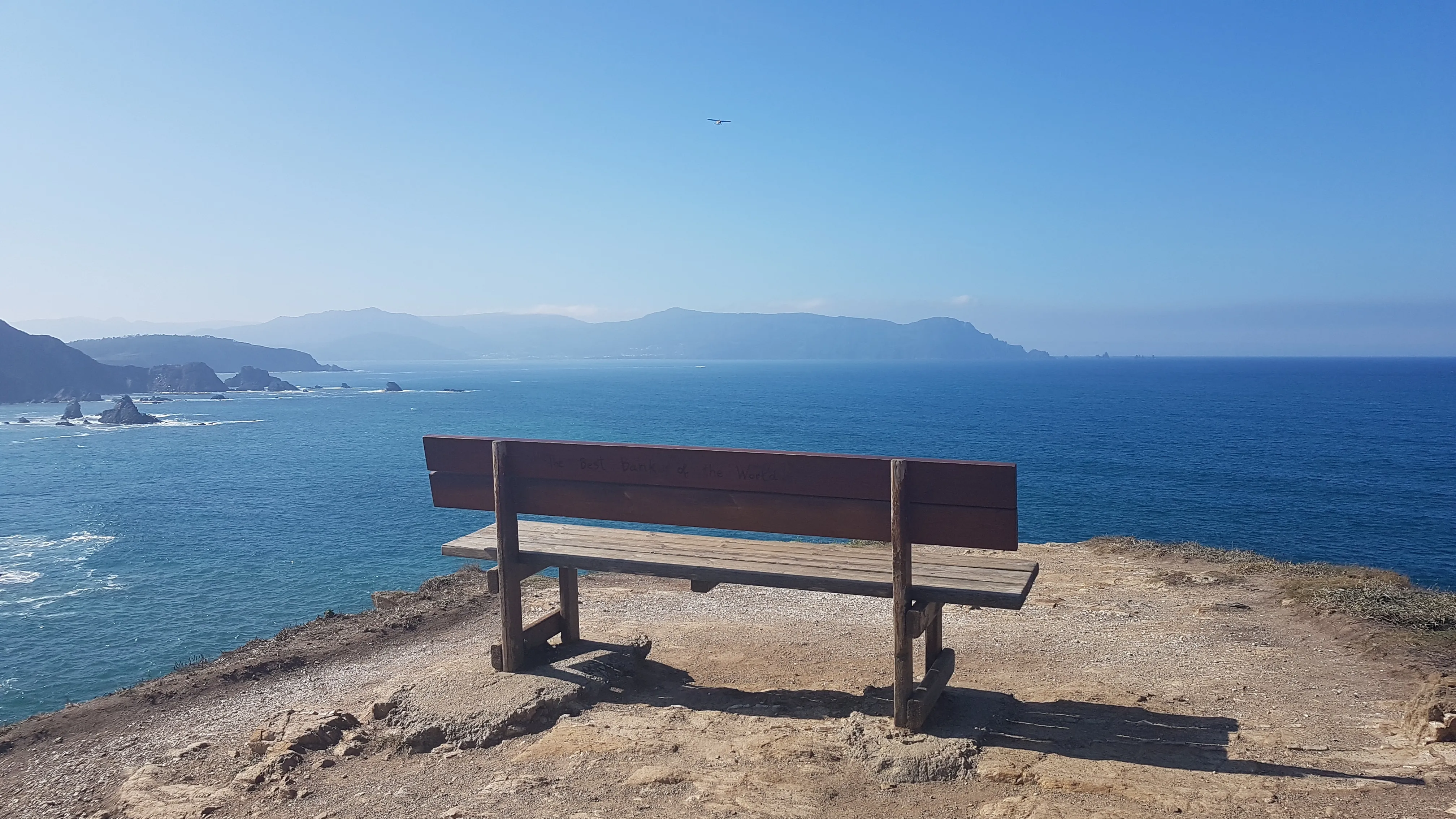 A bench overlooking Galicia’s Atlantic coast, within reach on a day trip from Santiago.