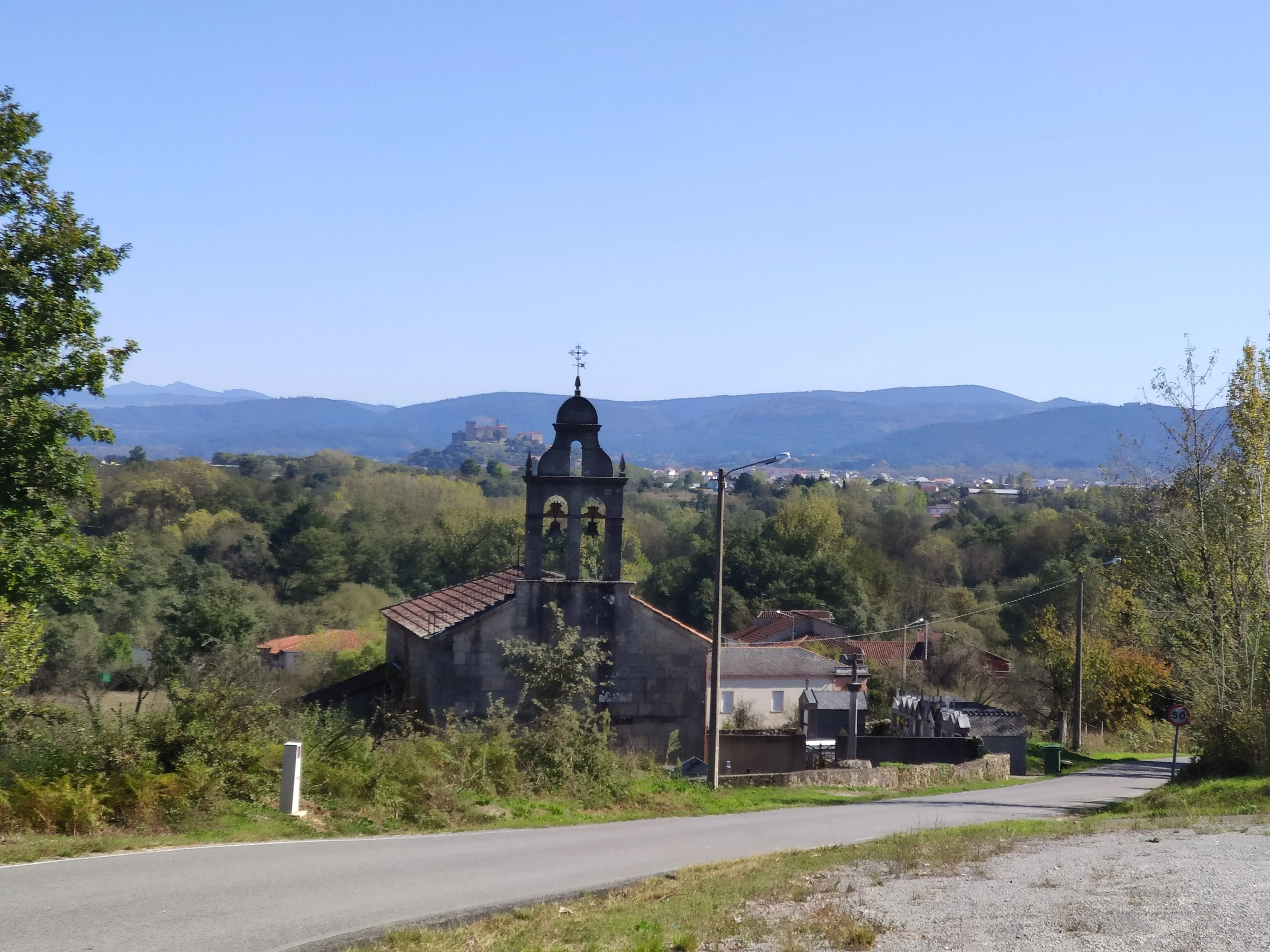 A rural church and mountain landscape along the Winter Way.