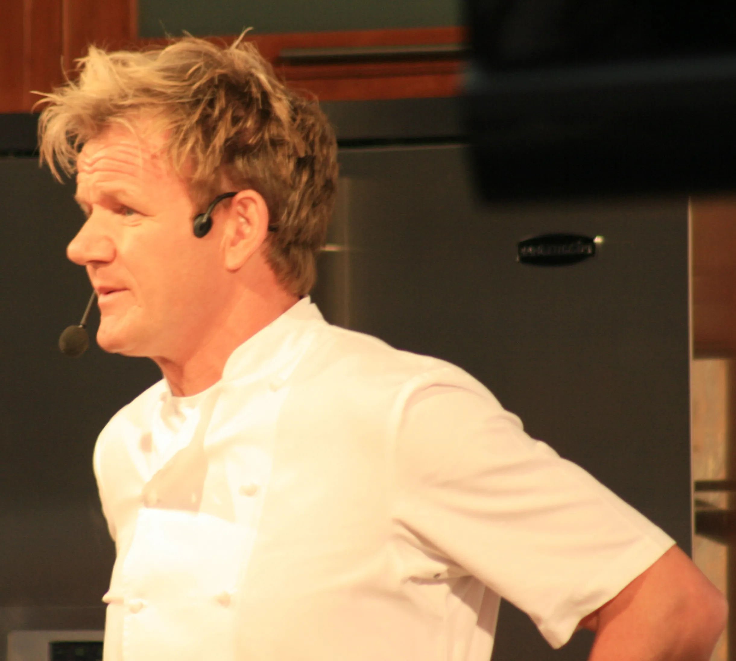 Chef Gordon Ramsay speaking during a live cooking event.