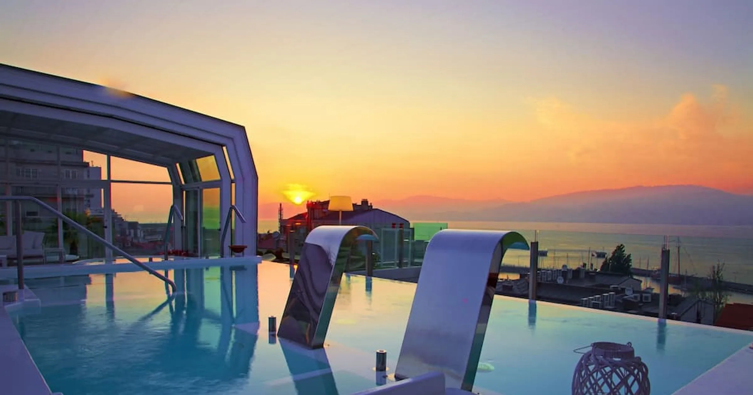 The rooftop Skyline pool at Gran Hotel Nagari overlooking Vigo at sunset.
