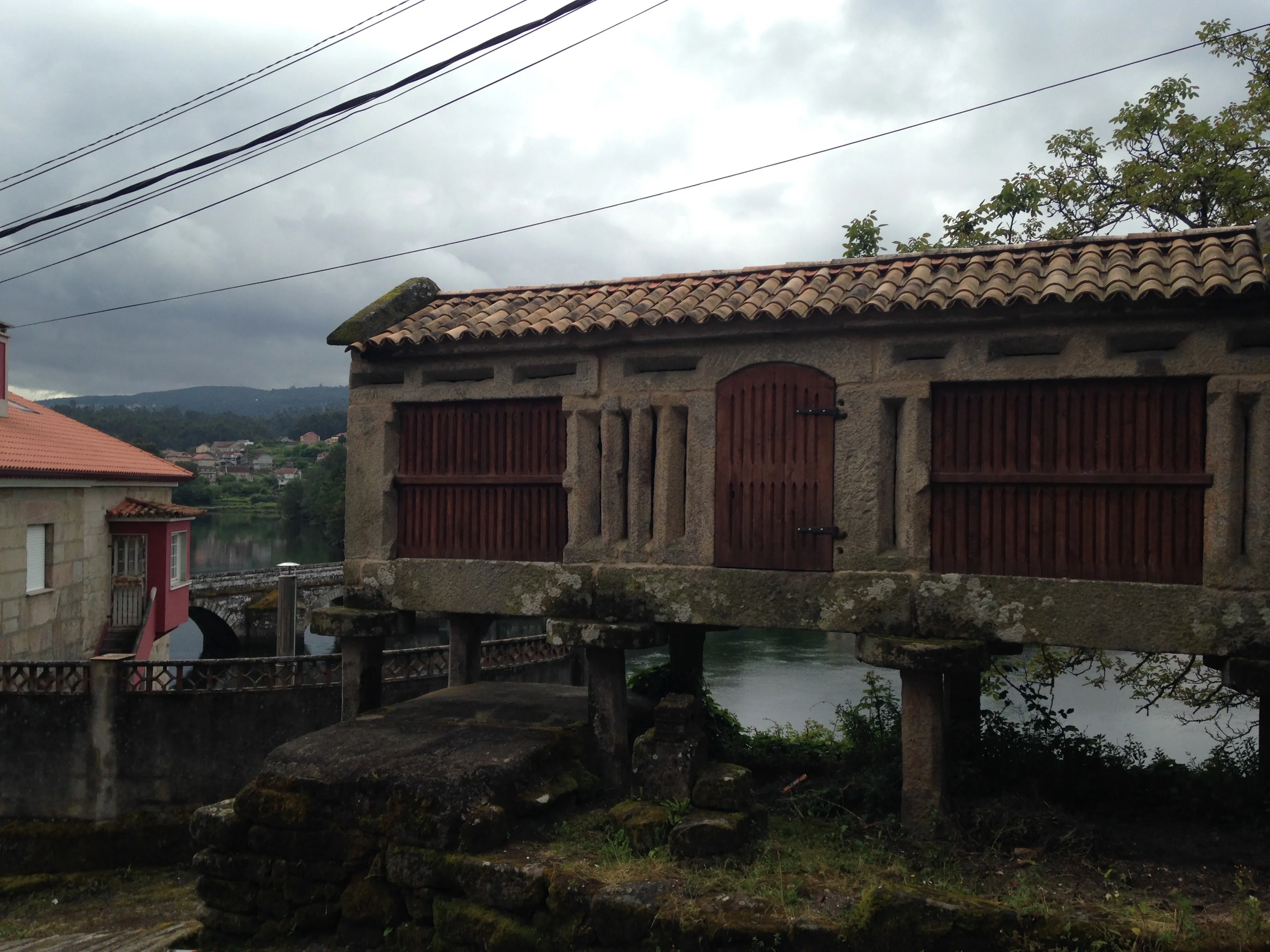A granite church and arcaded square in a Galician town.