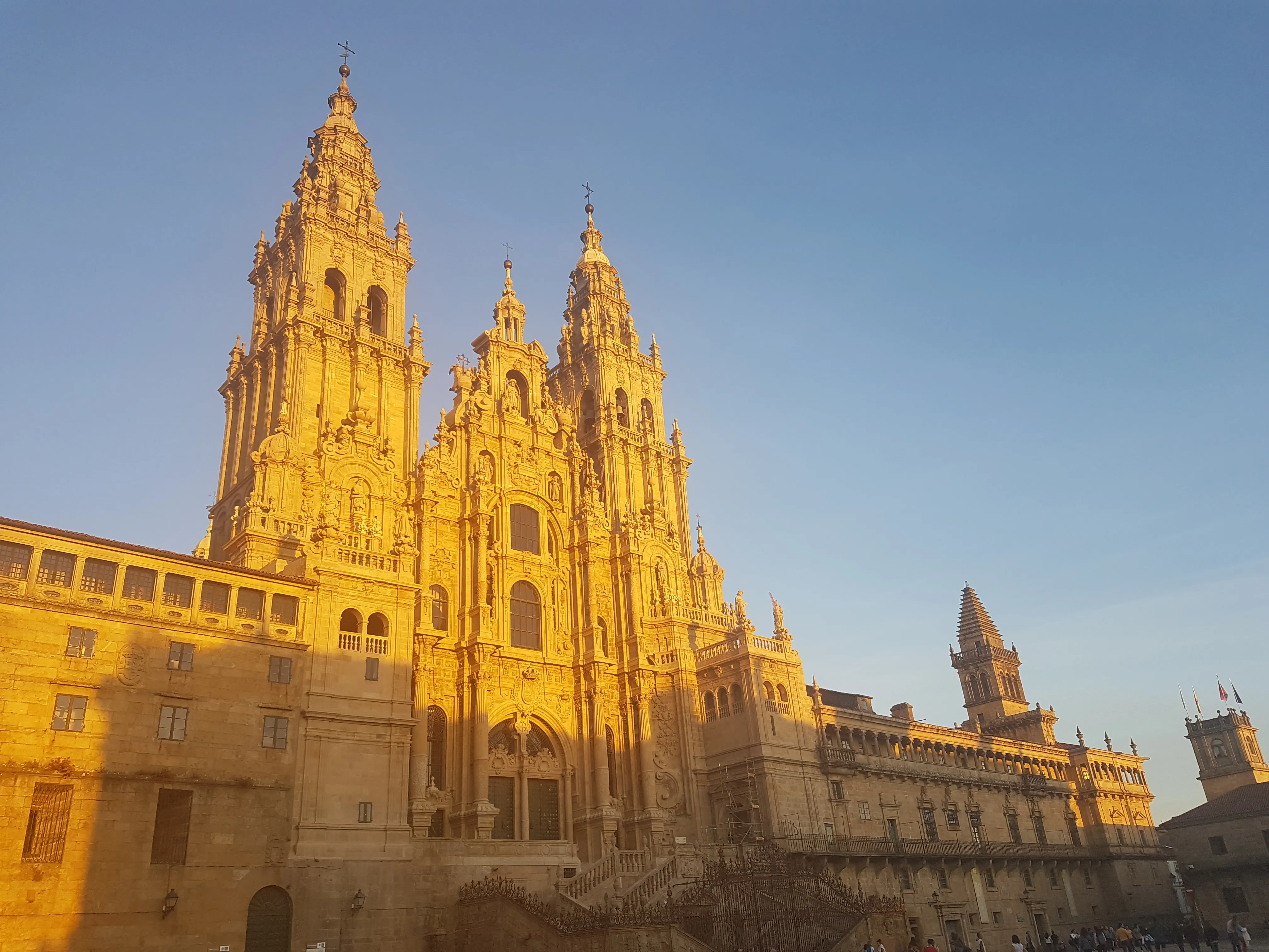 Santiago Cathedral glowing in the evening light above Praza do Obradoiro.