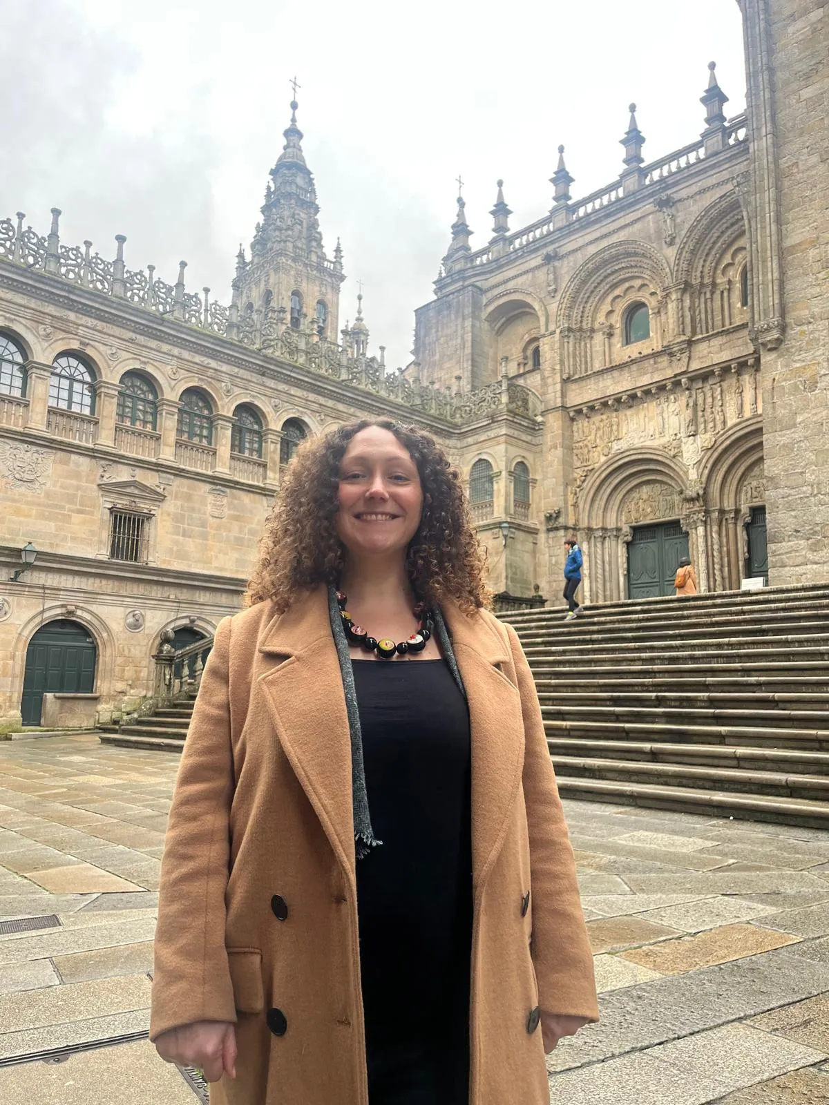 Nellie Meunier in front of Santiago de Compostela Cathedral.