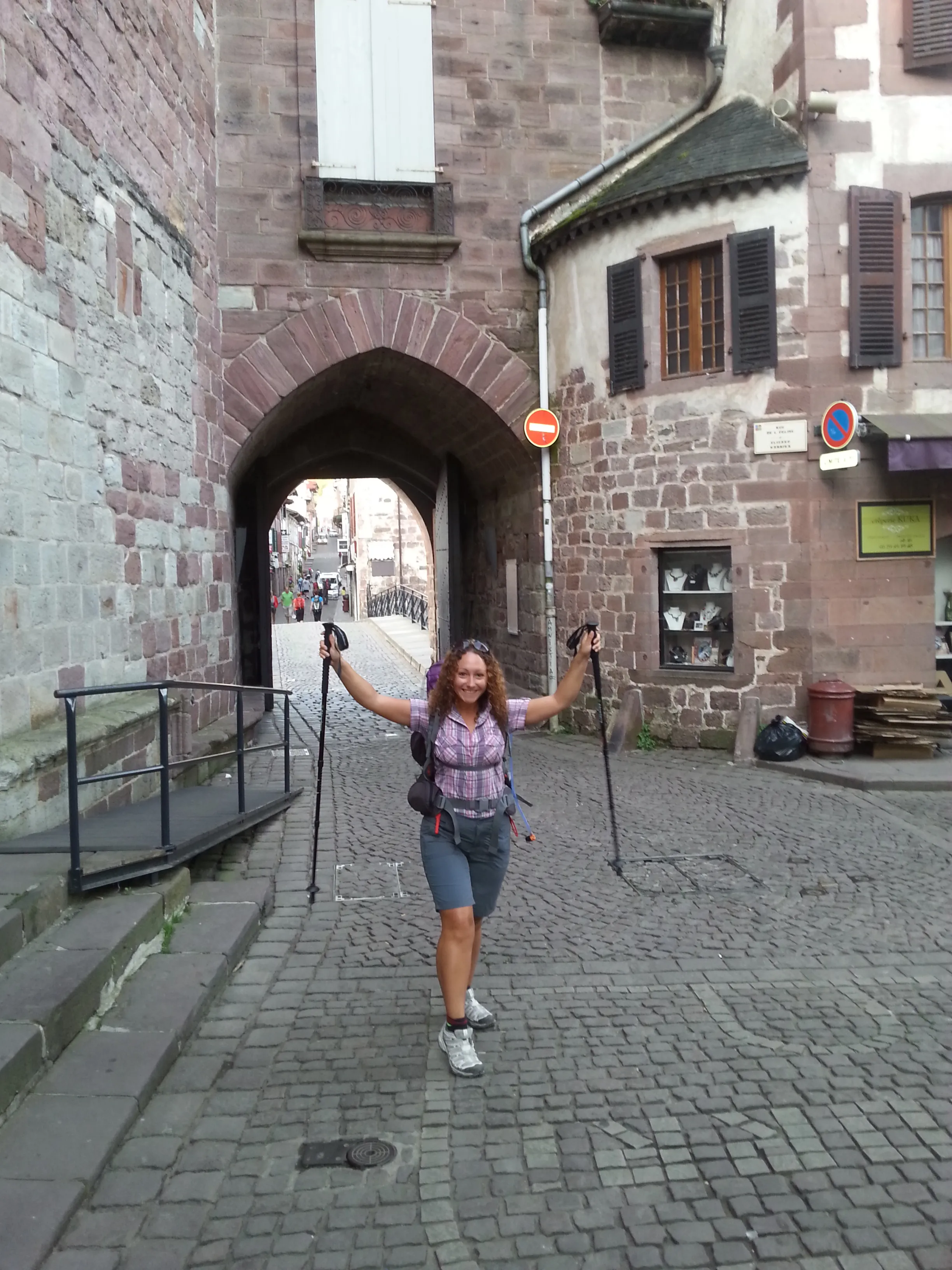 Nellie Meunier beside a Camino sign at Saint-Jean-Pied-de-Port.