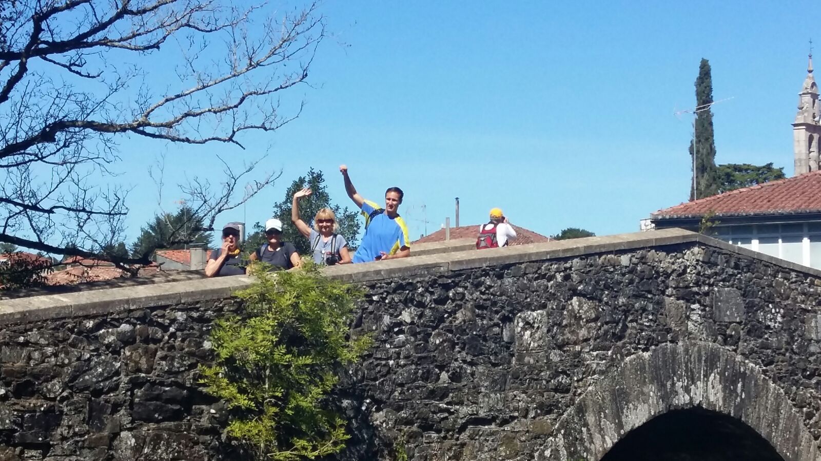 A group of Ultreya Tours travelers together beside the Atlantic coast.
