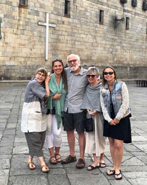 Group of pilgrim on the Quintana Square of the Cathedral of Santiago de Compostela at the end of the Camino de Santiago